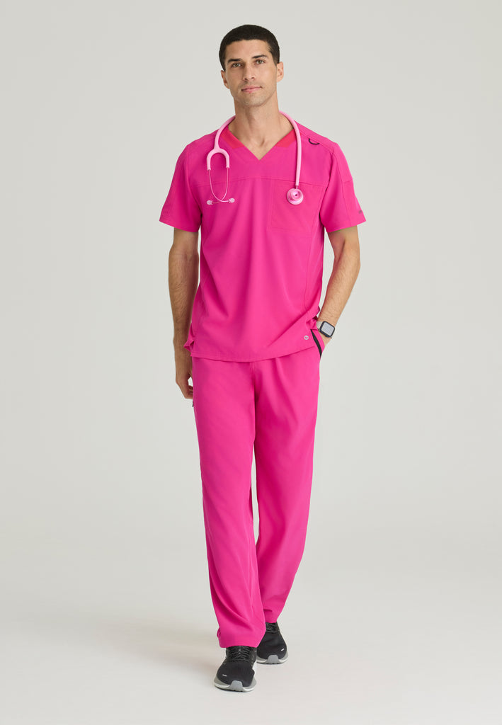 Full Body View of the Velocity 2-Pocket V-Neck Scrub Top in Pink from Barco One